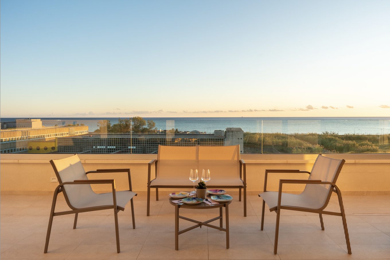 Private balcony with morning light and views over the sea